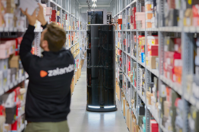 Zalando warehouse with employees working alongside mobile robots