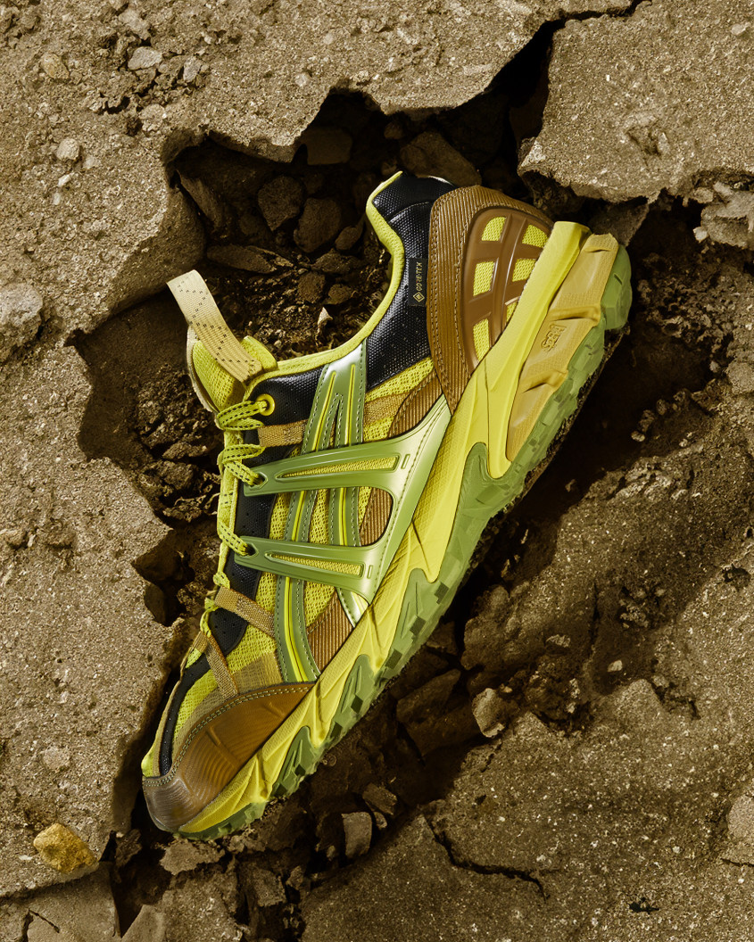 Sneaker located inside a crack in the dry ground